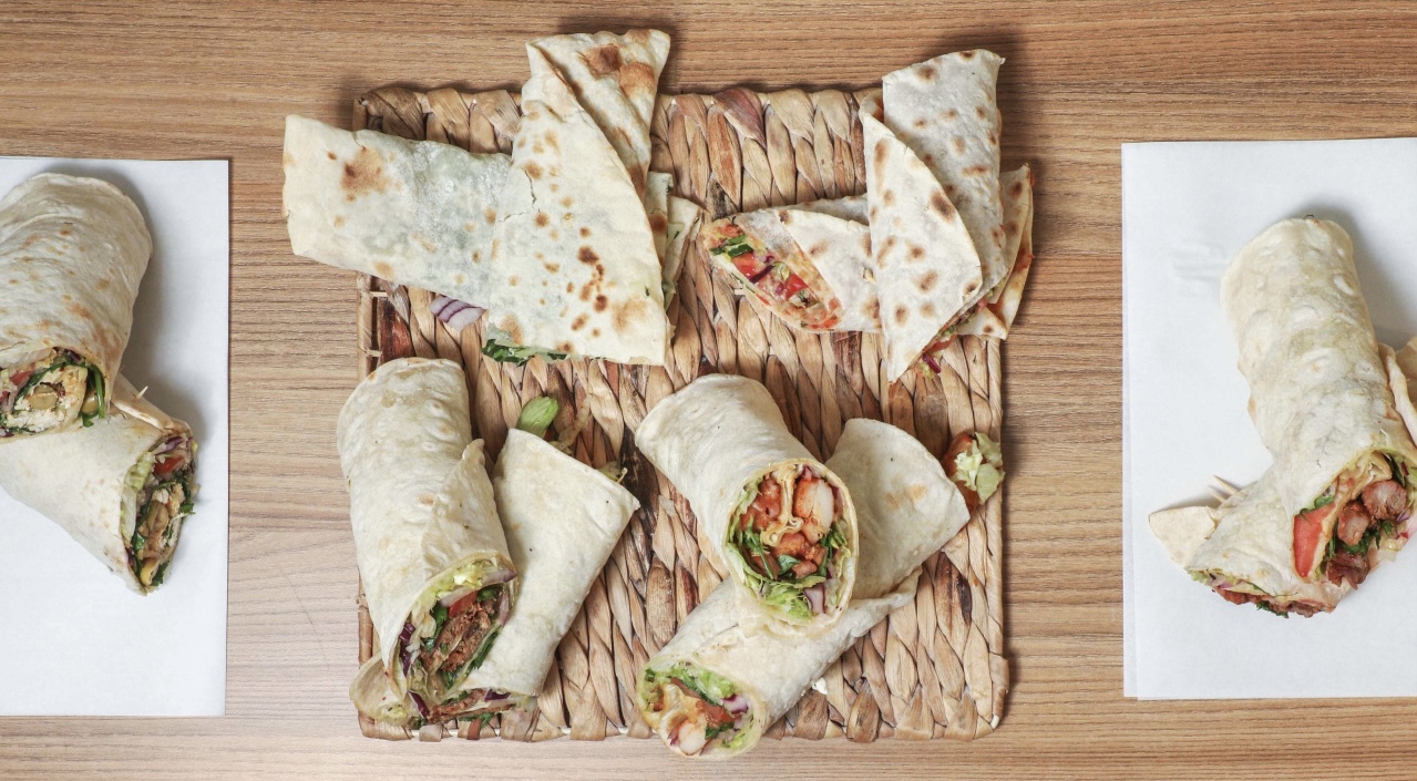 Dürüms placed on a wooden plate